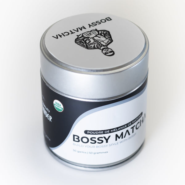 Pure matcha tea powder tin package on white background - top view