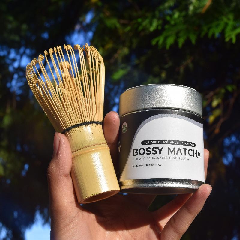 Matcha tea can packaging with original bamboo whisk holding in hand